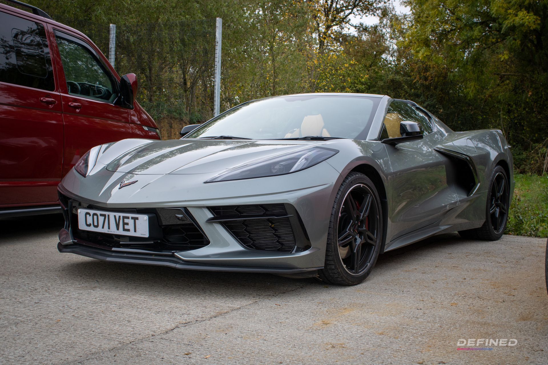 Gray Chevrolet Corvette sports car parked outdoors.