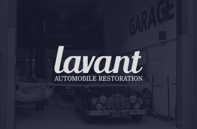 Lavant Automobile Restoration logo over garage interior with classic cars.