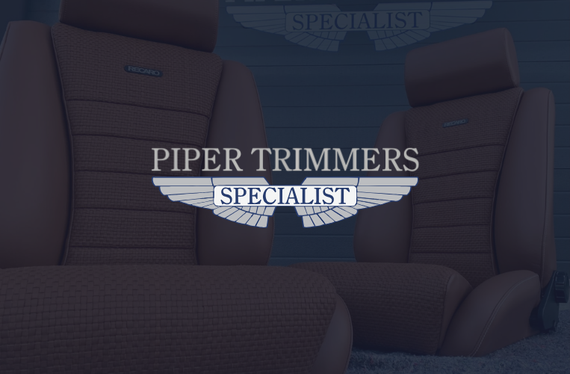 Car seats, Piper Trimmers logo overlayed. Brown leather seats, white text, and a stylized wing graphic.