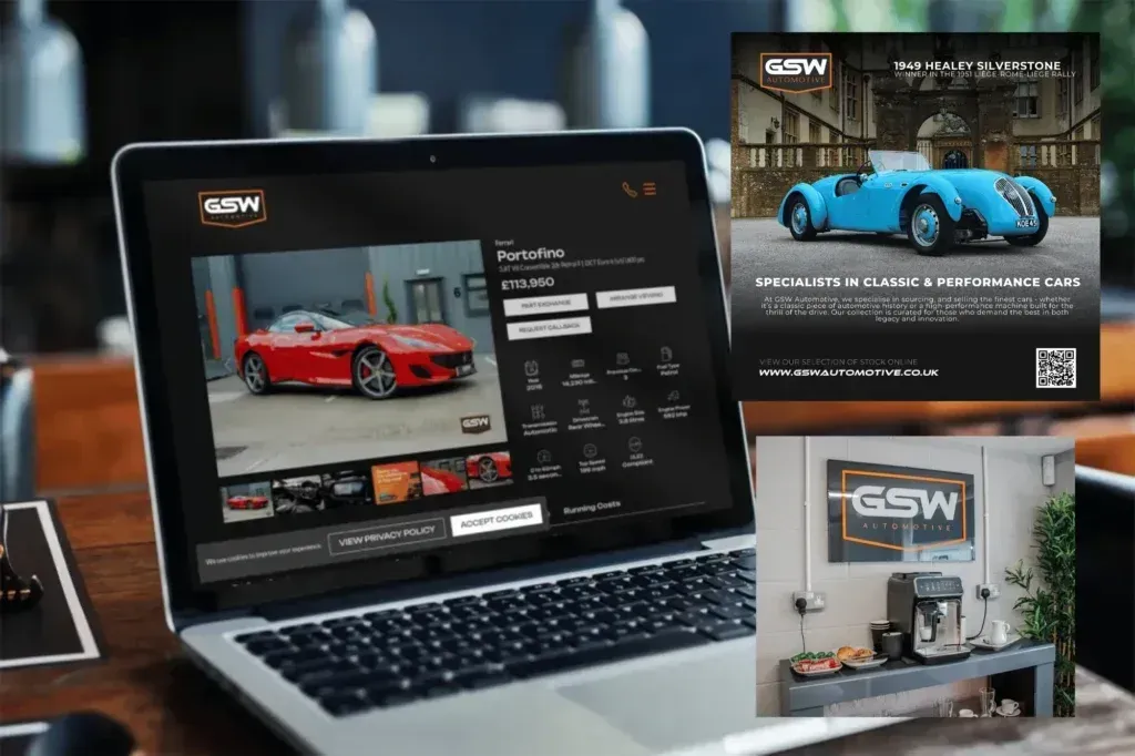 Laptop displaying a car configurator on a wooden table, with an advertisement for a blue car and a coffee bar.