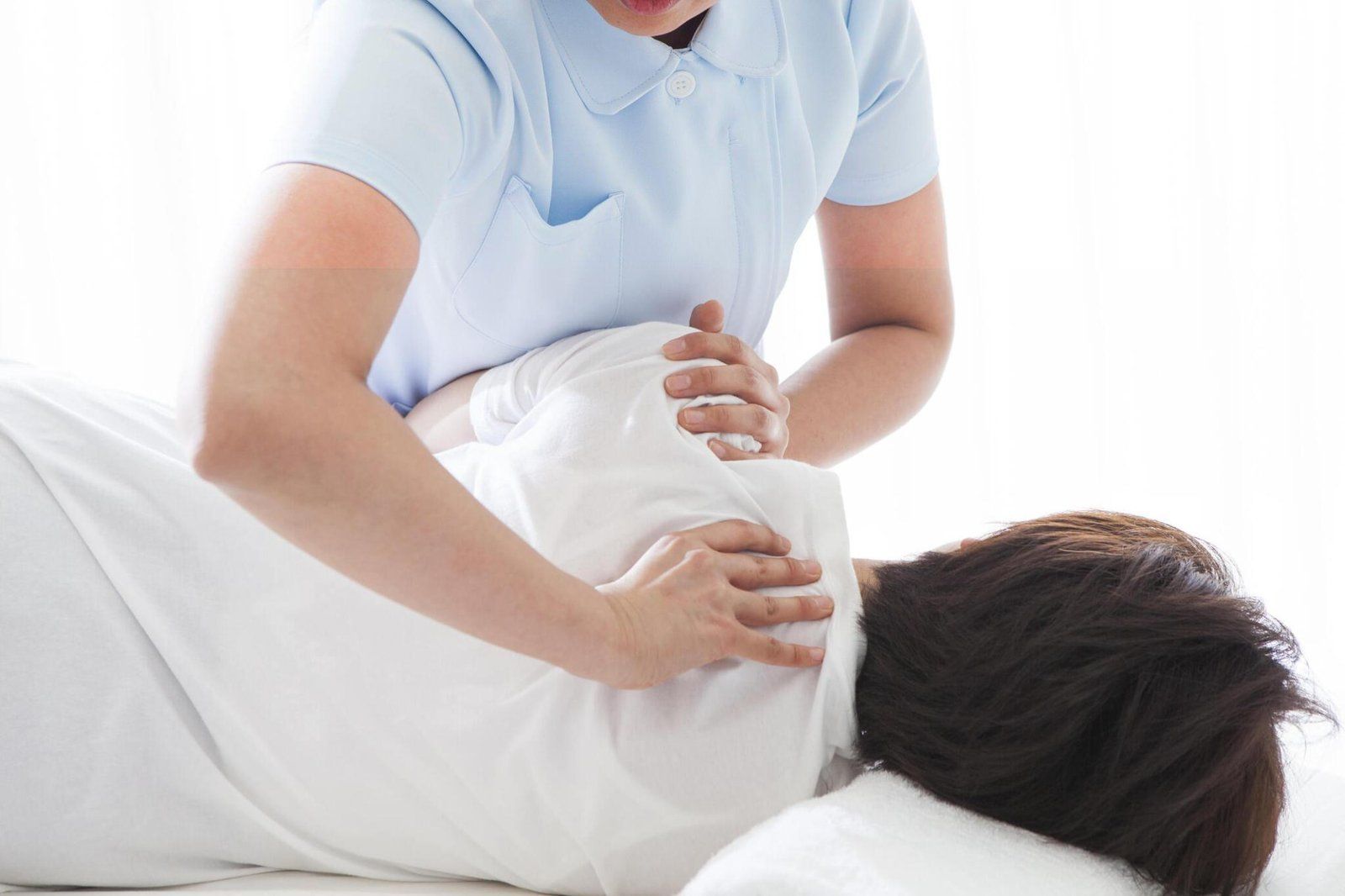 woman performing sports massage