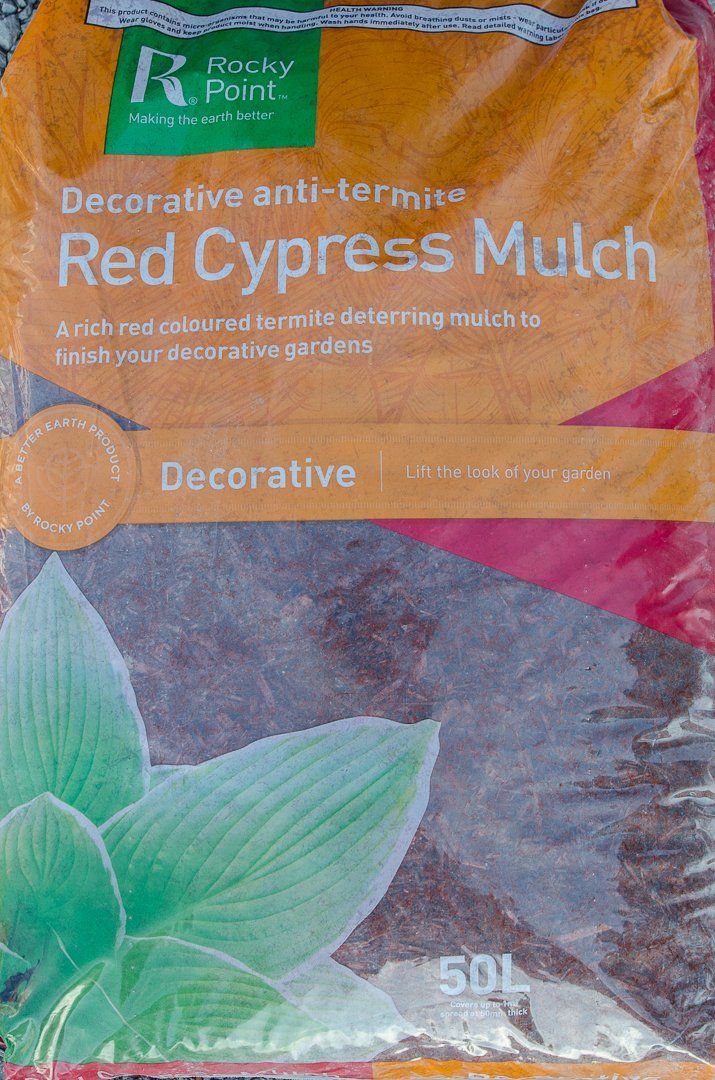 A bag of decorative anti-termite red cypress mulch.