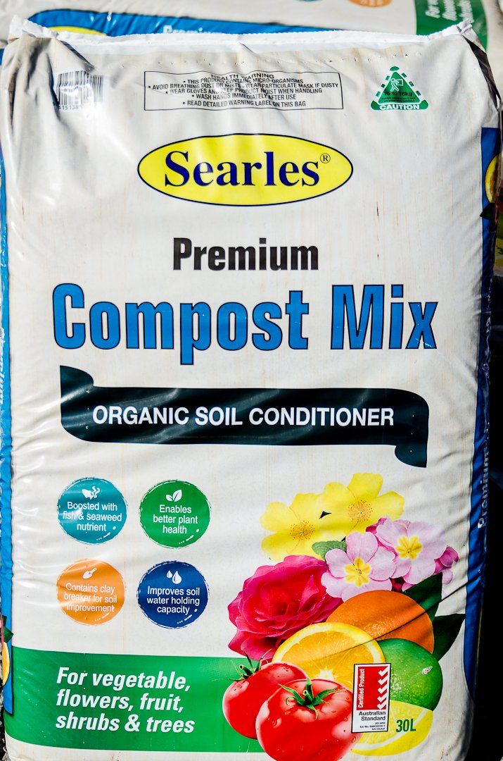 A bag of Searles premium compost mix organic soil conditioner.