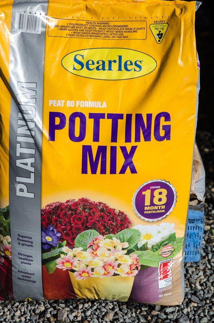 A bag of premium Searles potting mix.