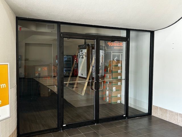 White glass door with sign on it, closeup
