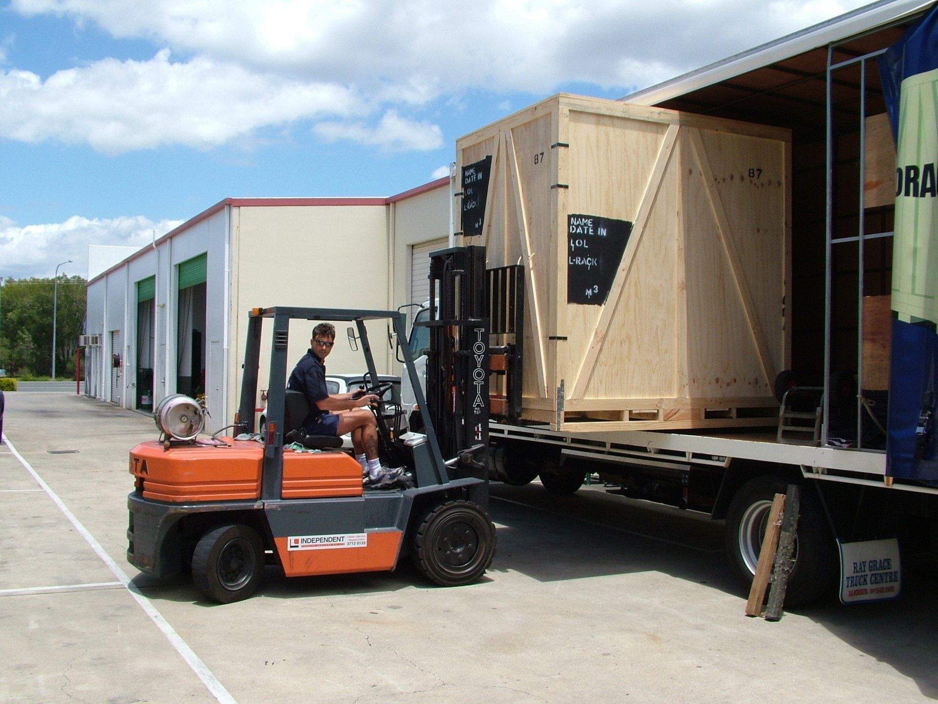 Unloading Moving Boxes with Fork Lift — Queensland — Affordable Home & Office Removals