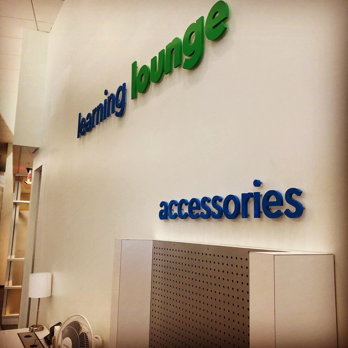A sign on a wall that says learning lounge accessories