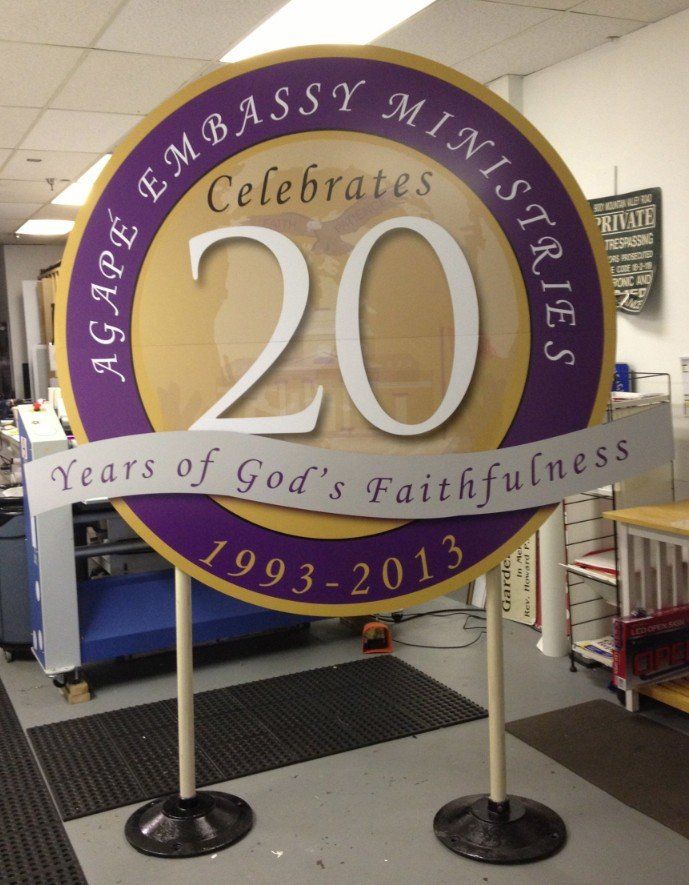 A sign for the embassy ministries celebrates 20 years of god 's faithfulness