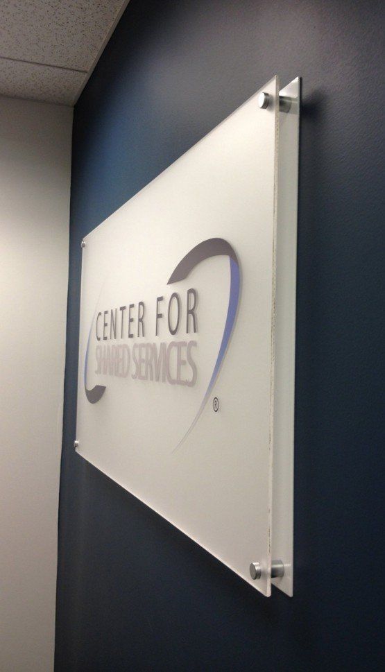 A sign on a wall that says center for award services