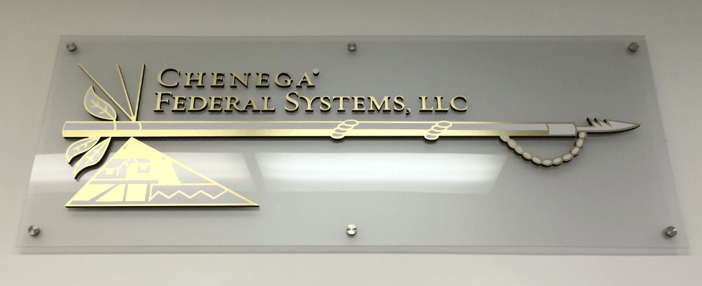 A sign that says ' queens federal systems llc ' on it