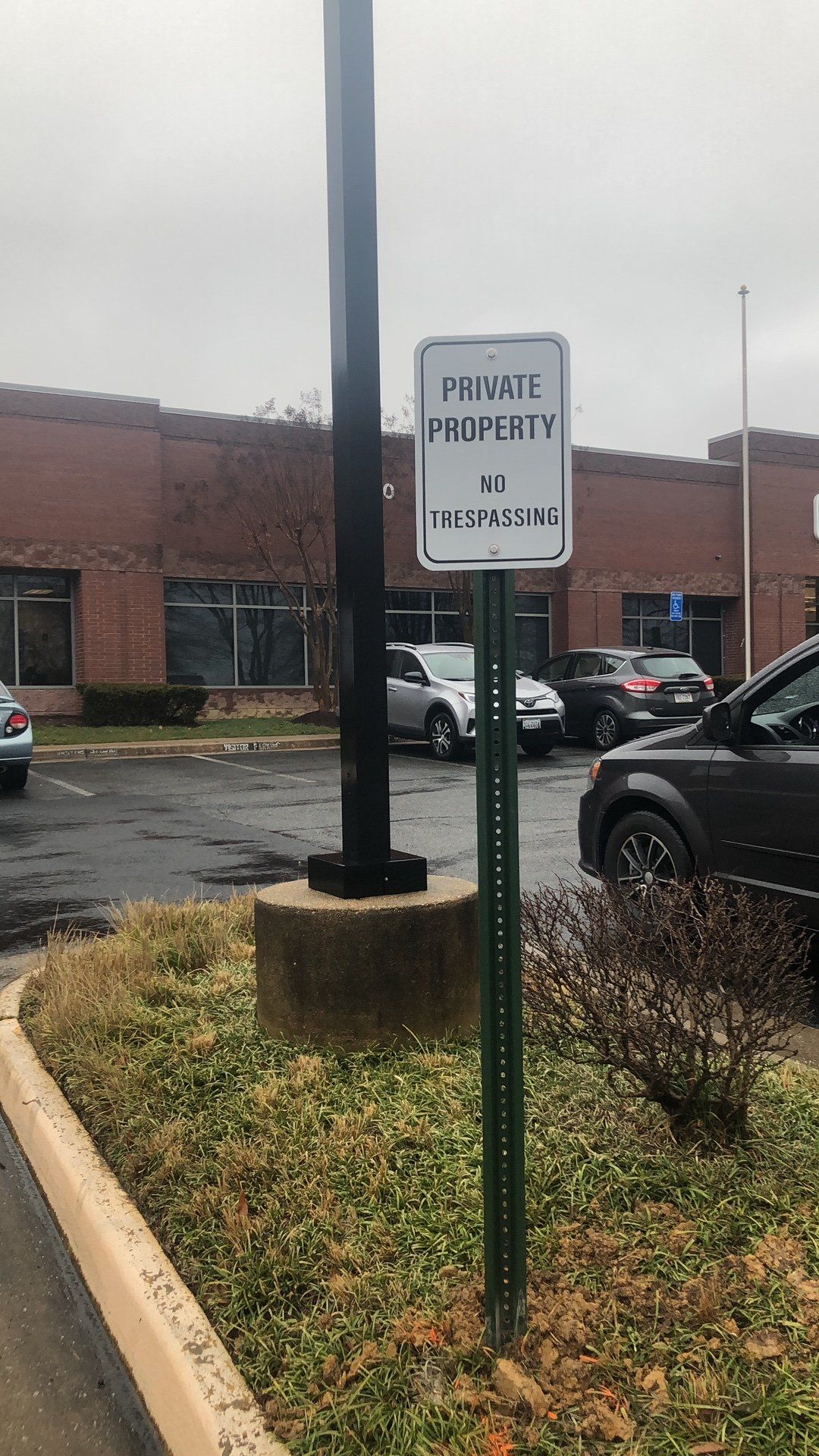 A parking lot with a sign that says private property on it.