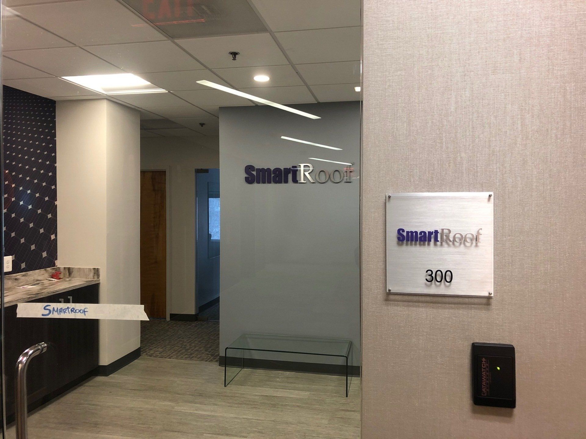 A room with a sign that says smart roof on it