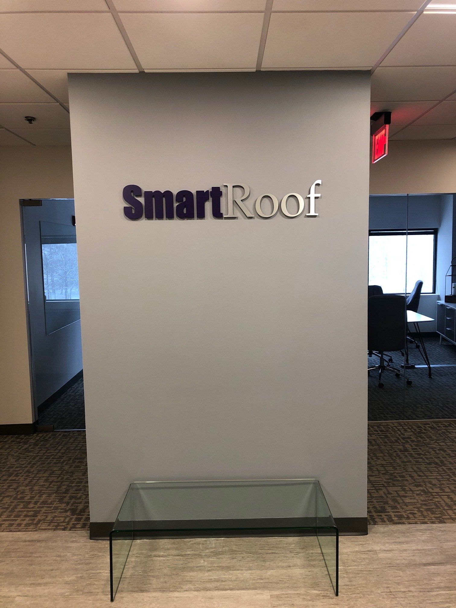 There is a sign on the wall that says smartroof.