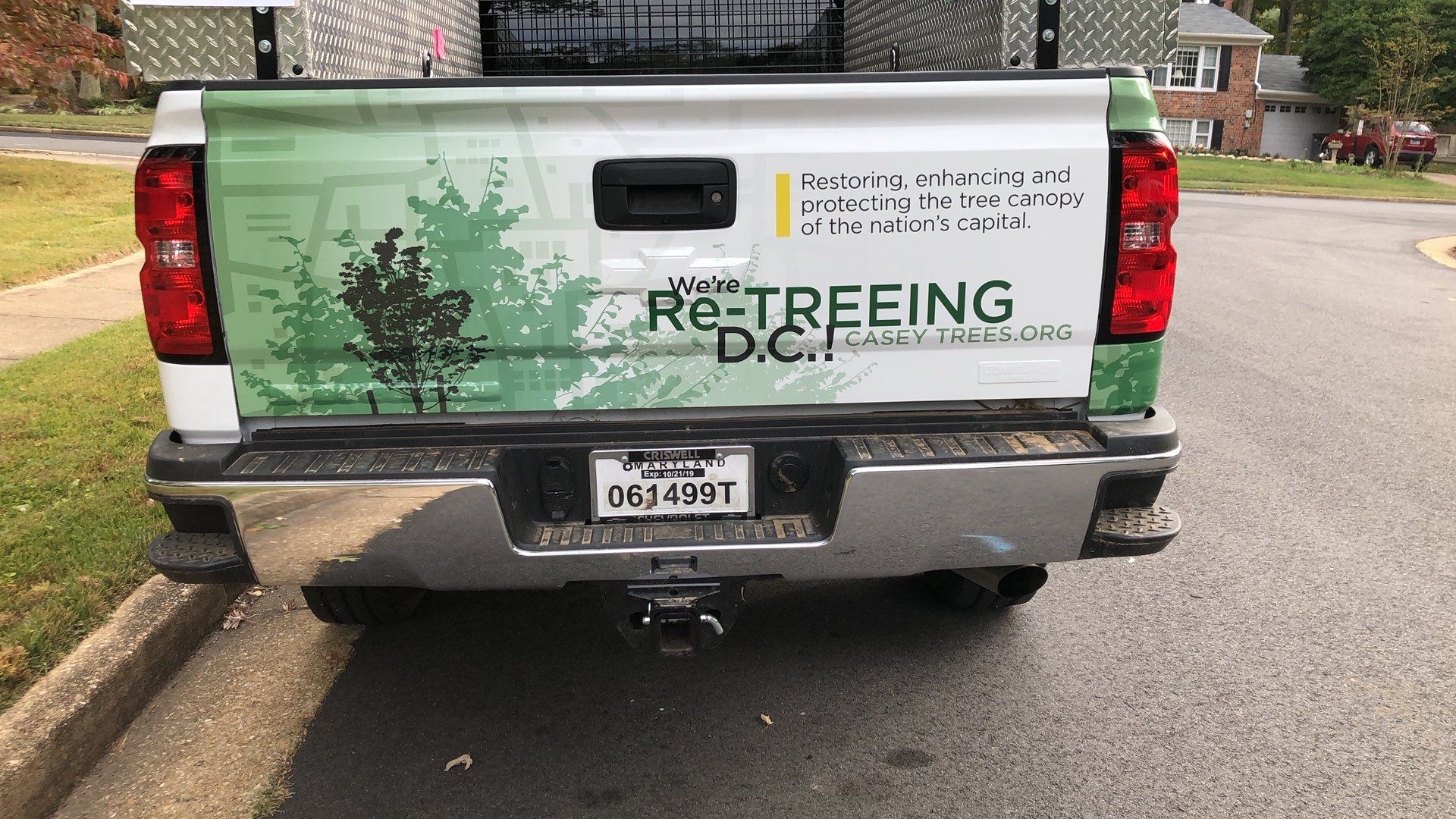 A truck is parked on the side of the road.