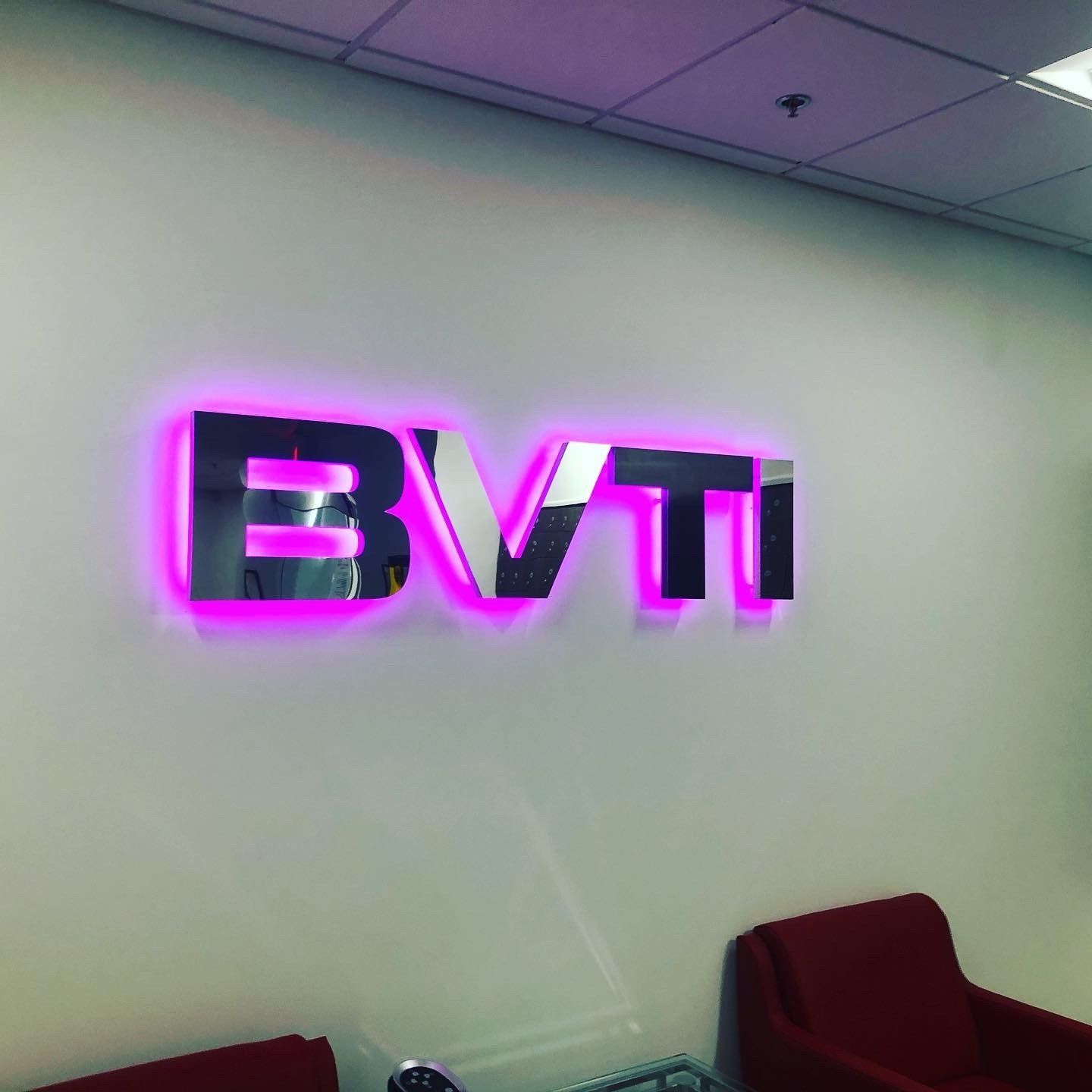 A sign on a wall that says bvti