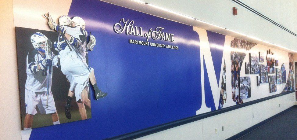 A wall with a picture of a lacrosse player on it