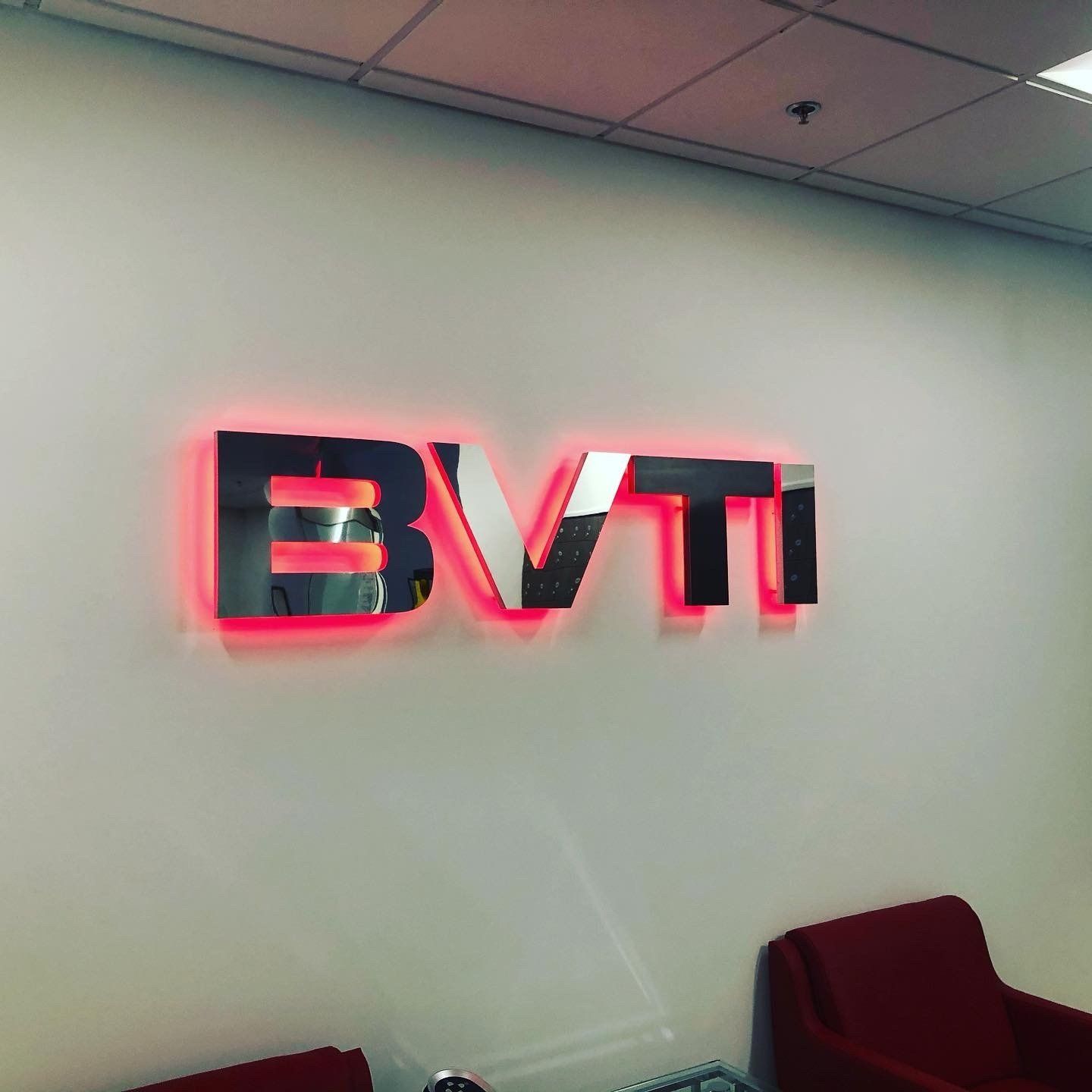 A sign on a wall that says bvti