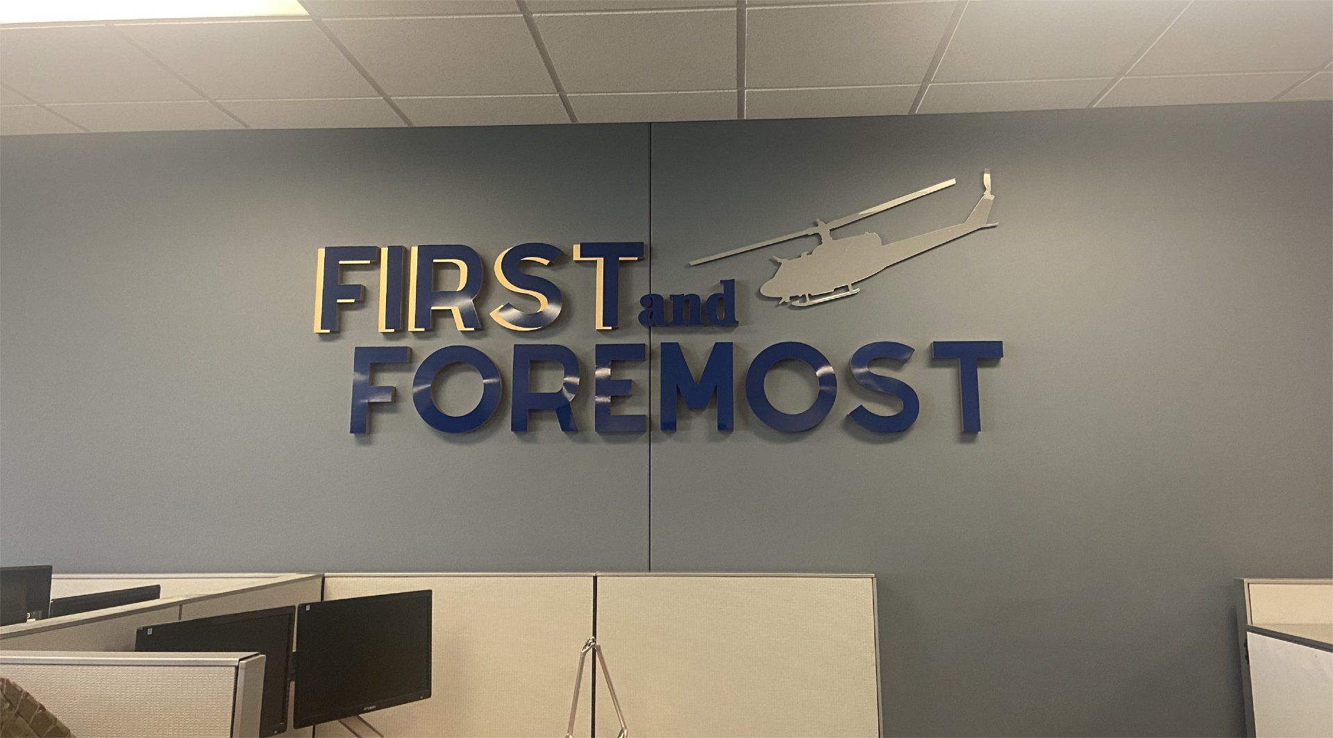 A sign on a wall that says first and foremost