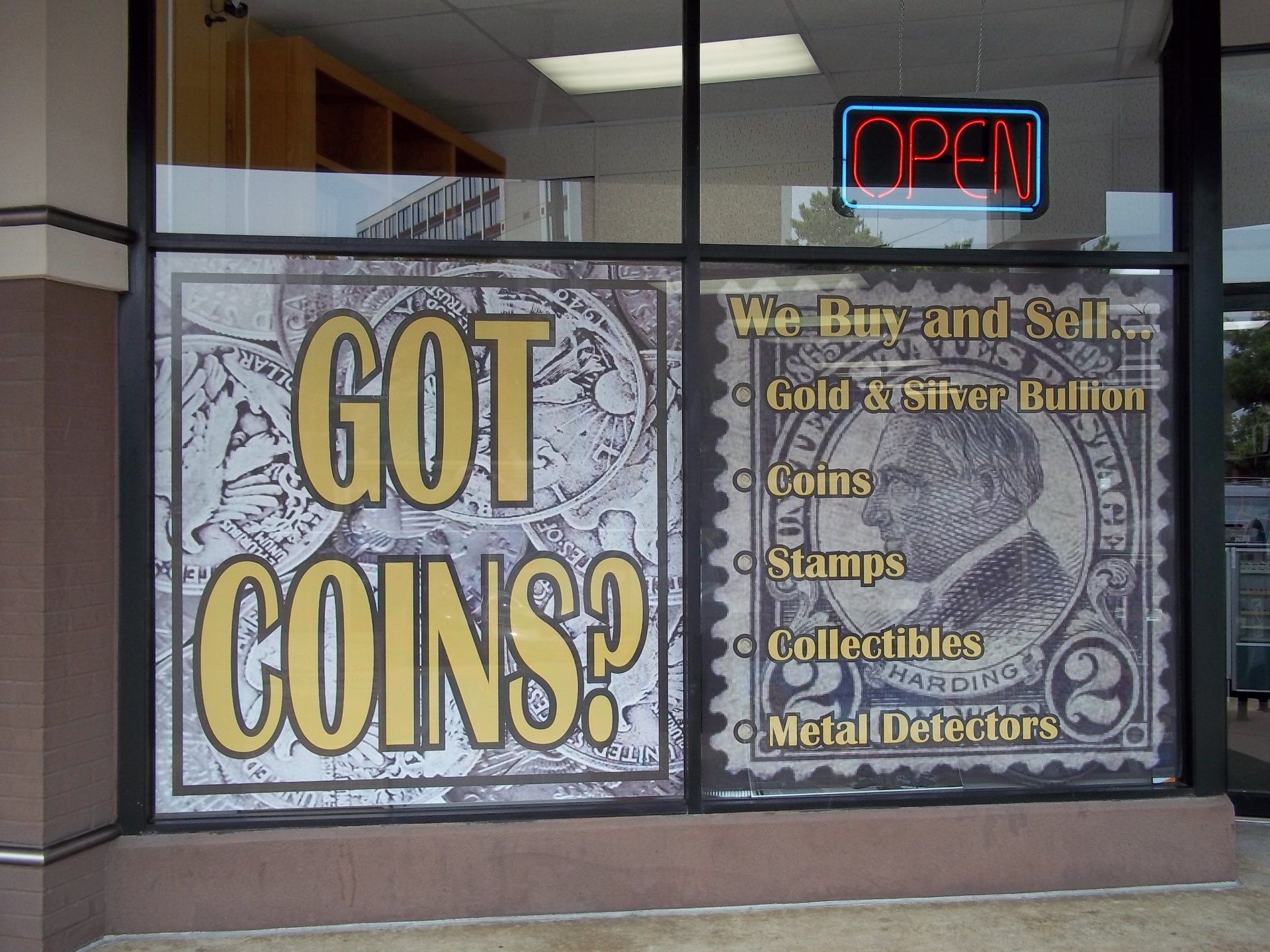 A store front with a sign that says got coins