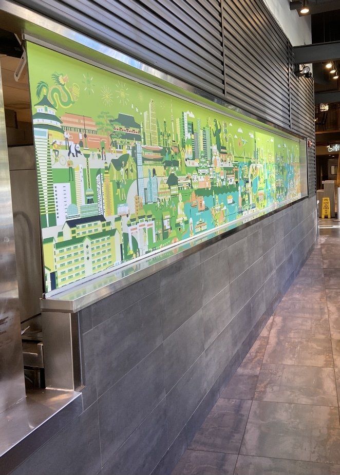 A long hallway with a large mural on the wall.