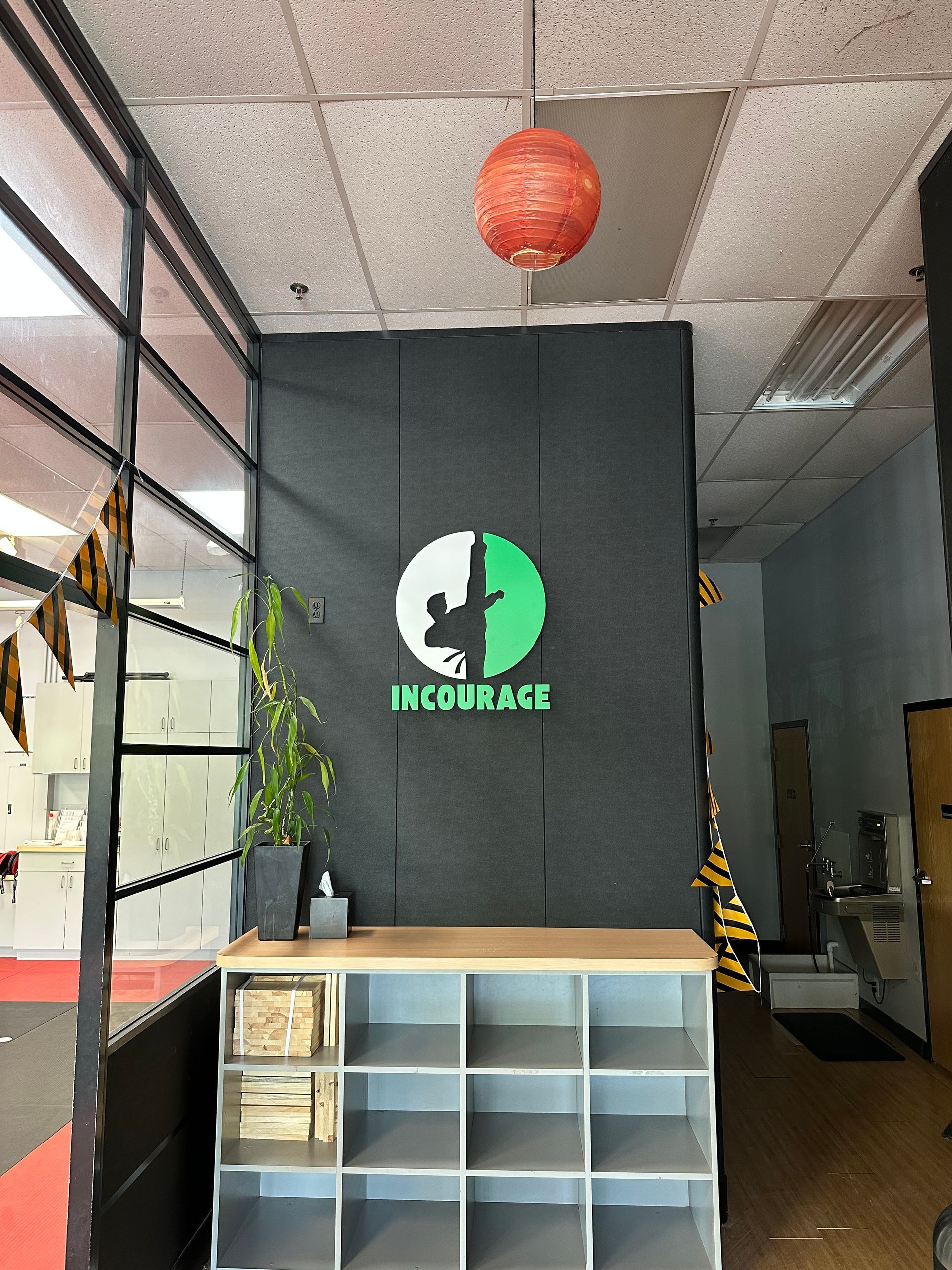 A room with a sign on the wall that says courage