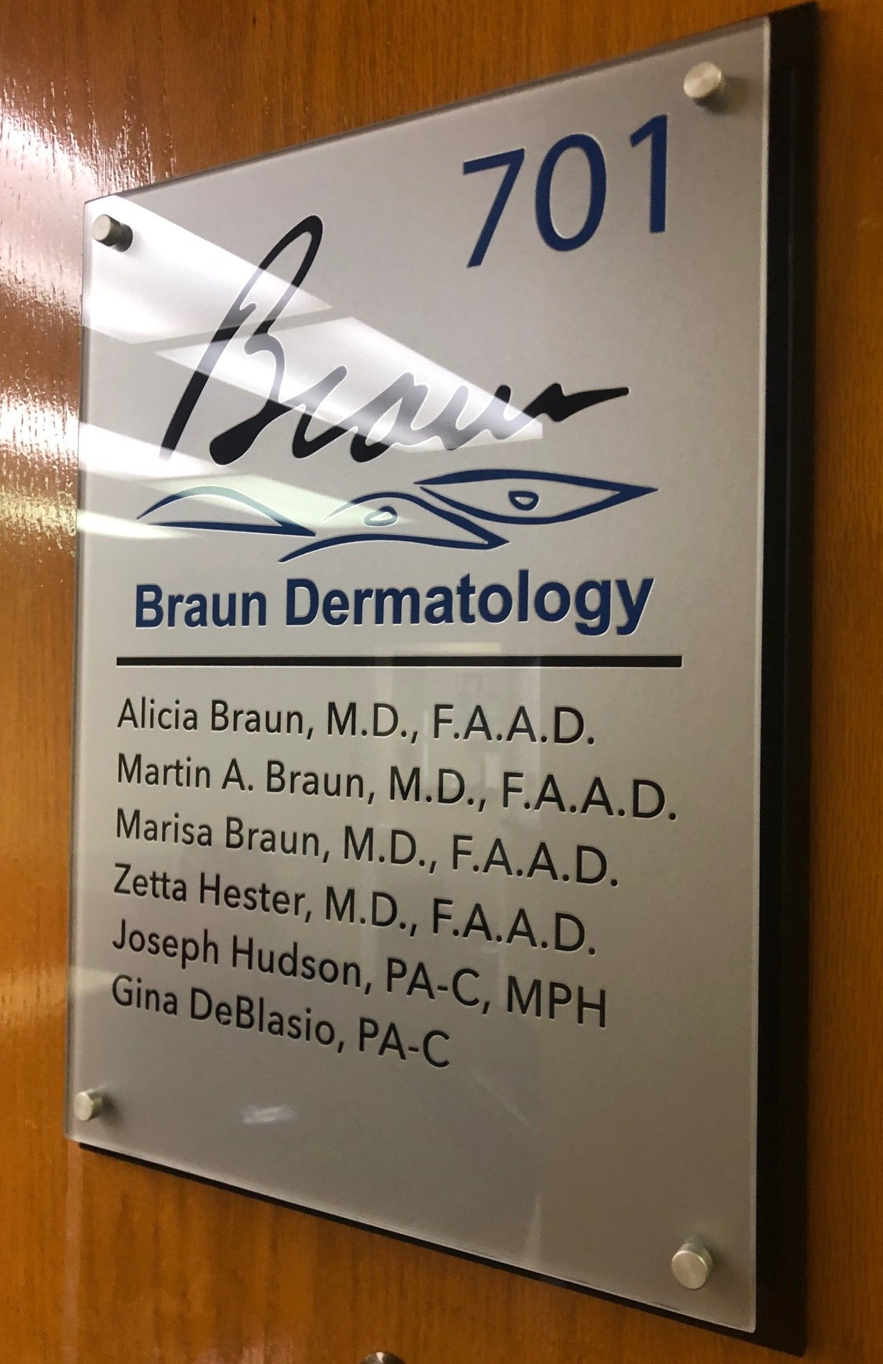 A sign on a door that says braun dermatology