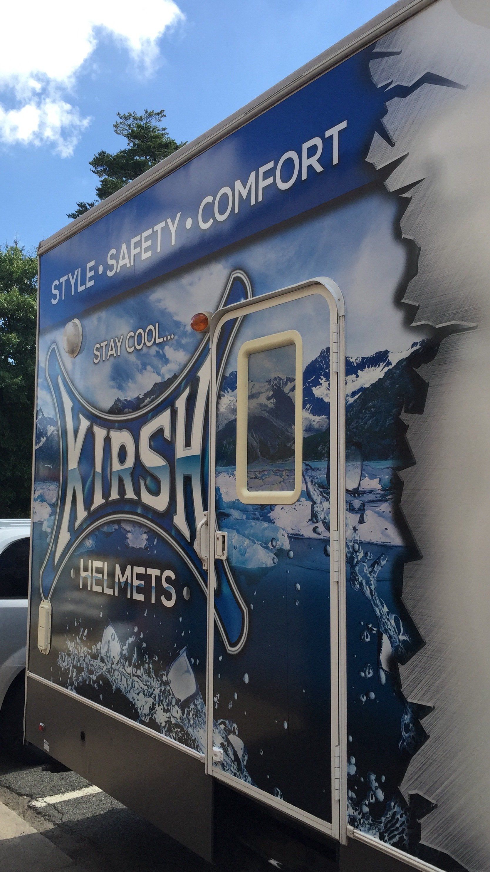 A trailer with a sticker on the side that says style safety comfort