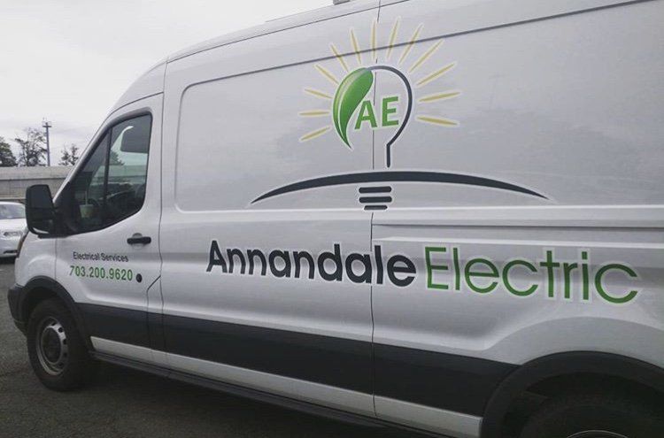 A white van that says annandale electric on the side