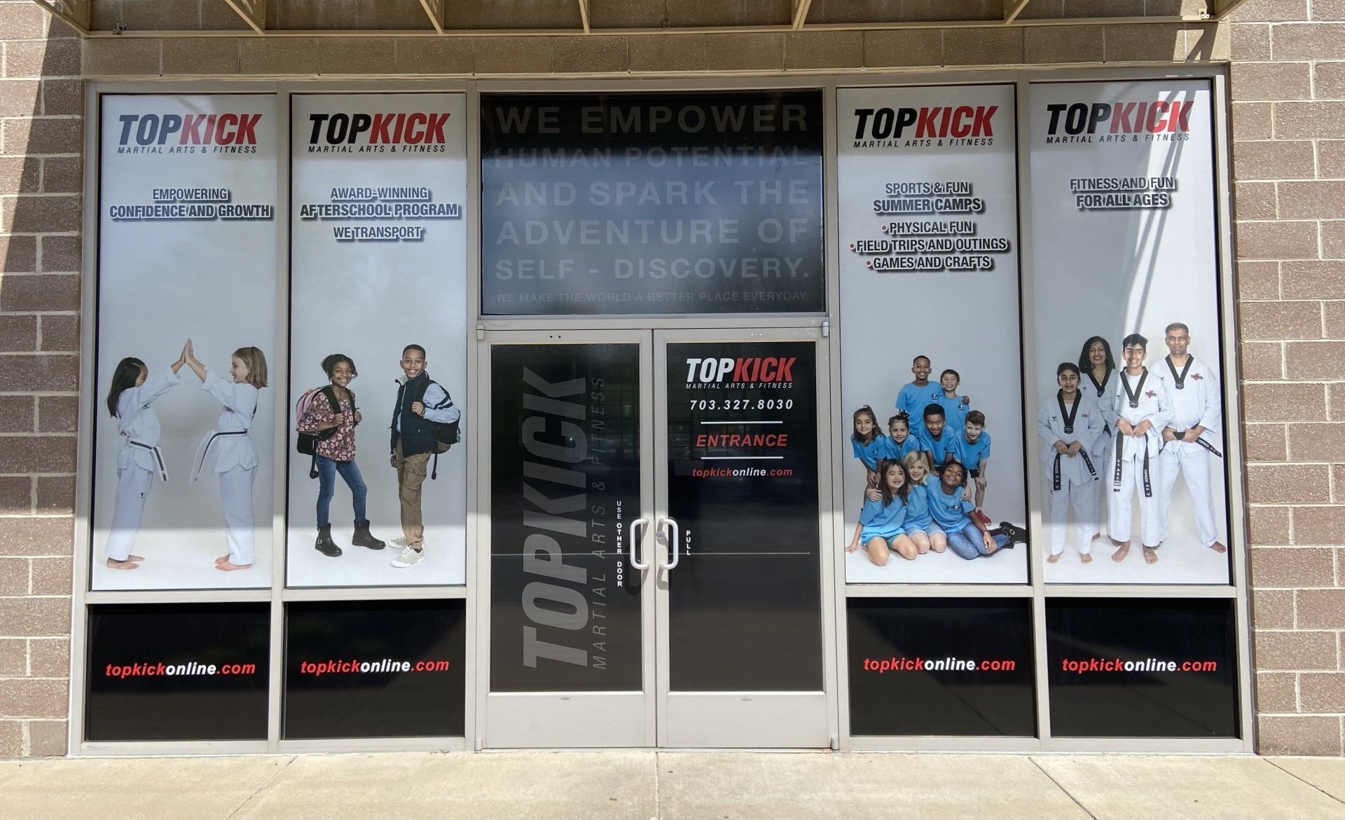 A brick building with a sign that says topkick on it