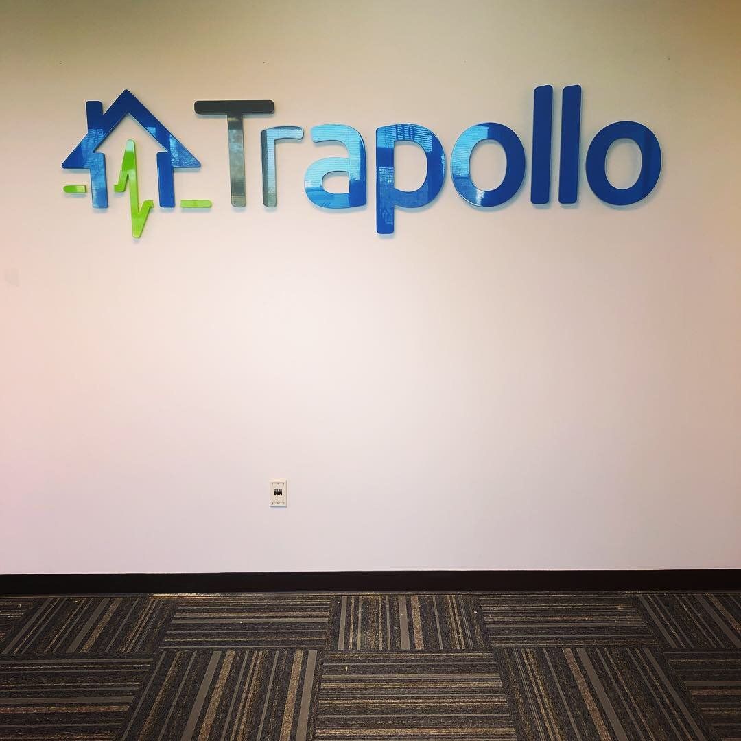 A wall with the word trapollo painted on it