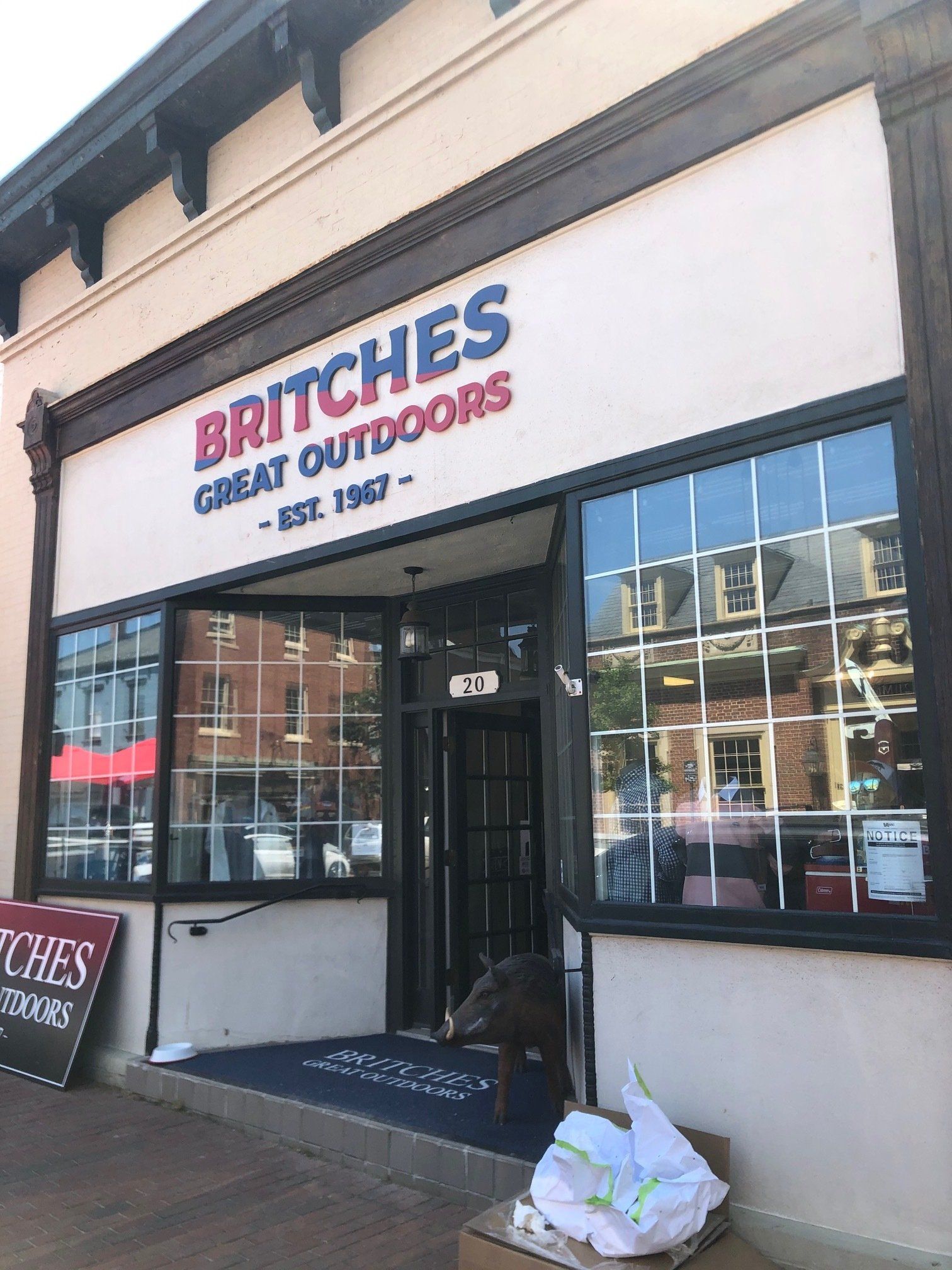 Britches great outdoors store front with a dog sitting outside