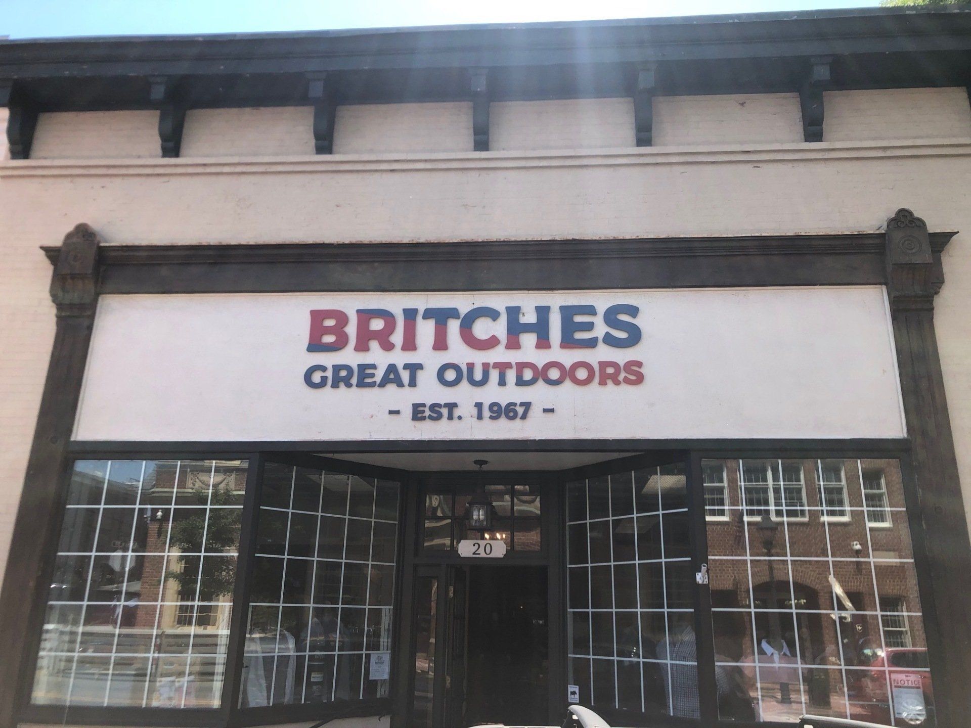 Britches great outdoors store front with a red white and blue sign