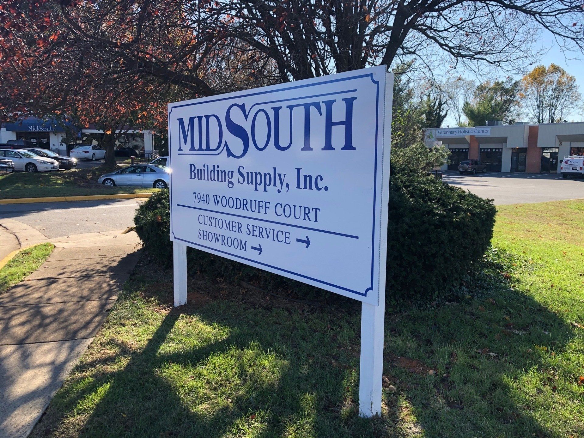 A white sign for midsouth building supply inc.