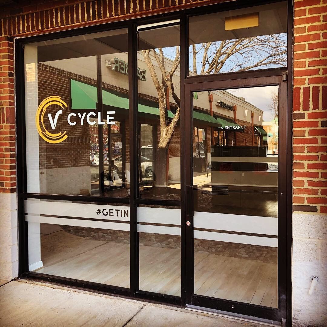 A store front with a sign that says v cycle on it