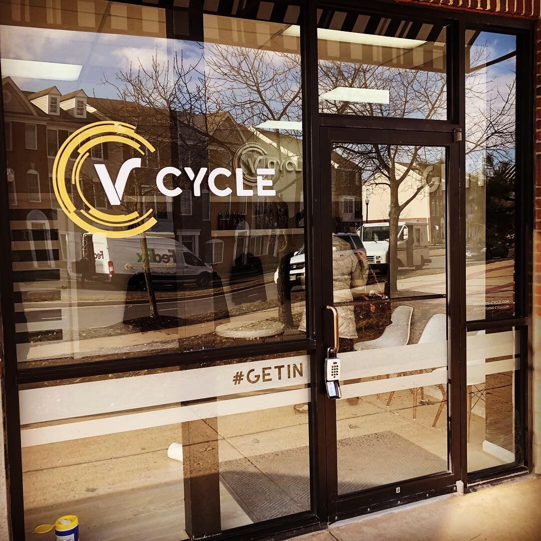 A store front with a sign that says v cycle