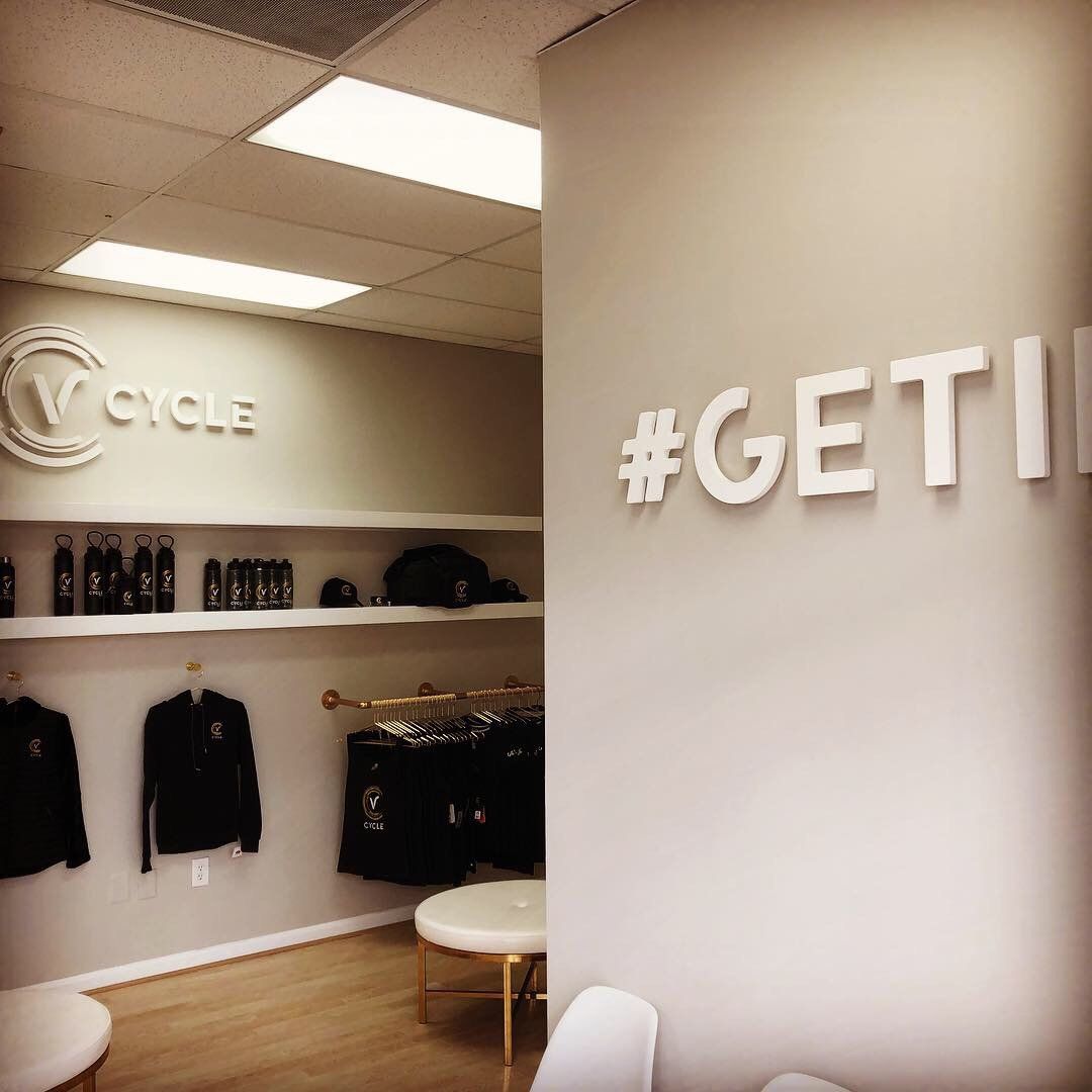 A room with a sign that says #getii