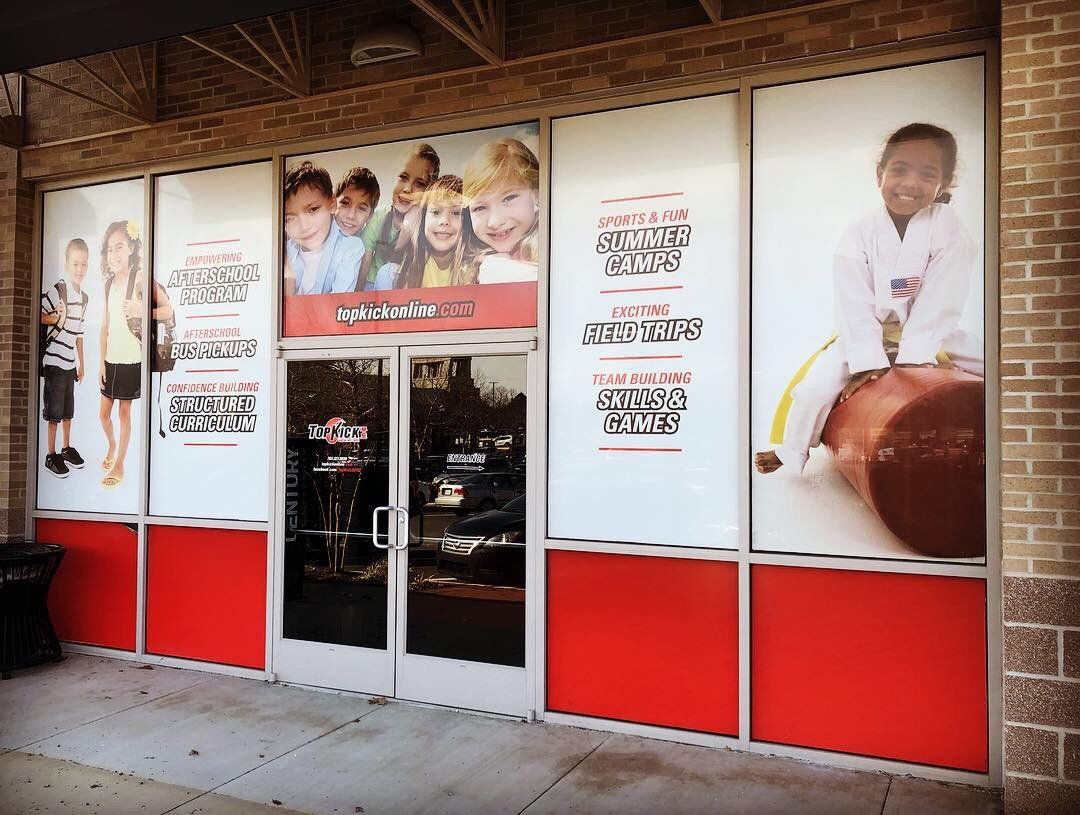 A store front with a lot of pictures on it