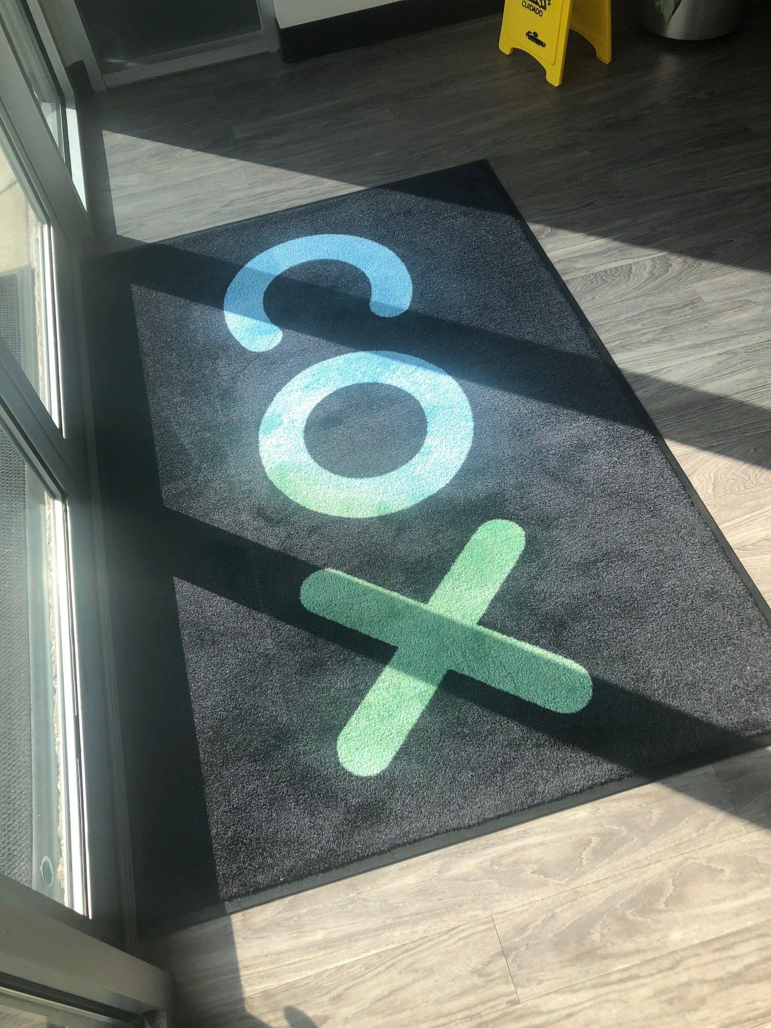 A door mat with the word cox written on it.