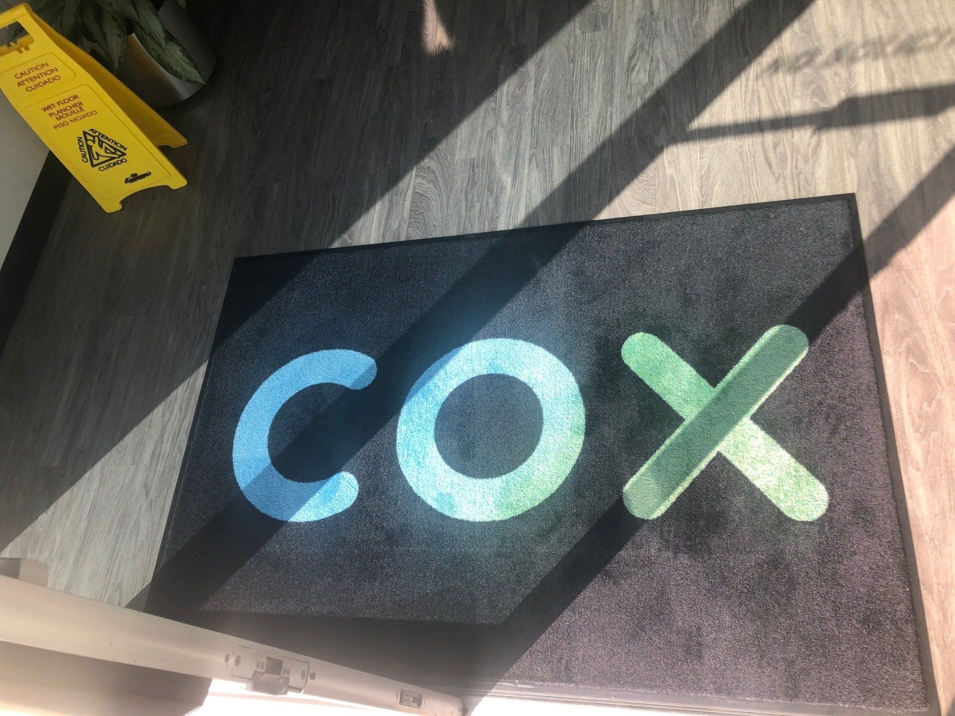 A black mat with the word cox on it