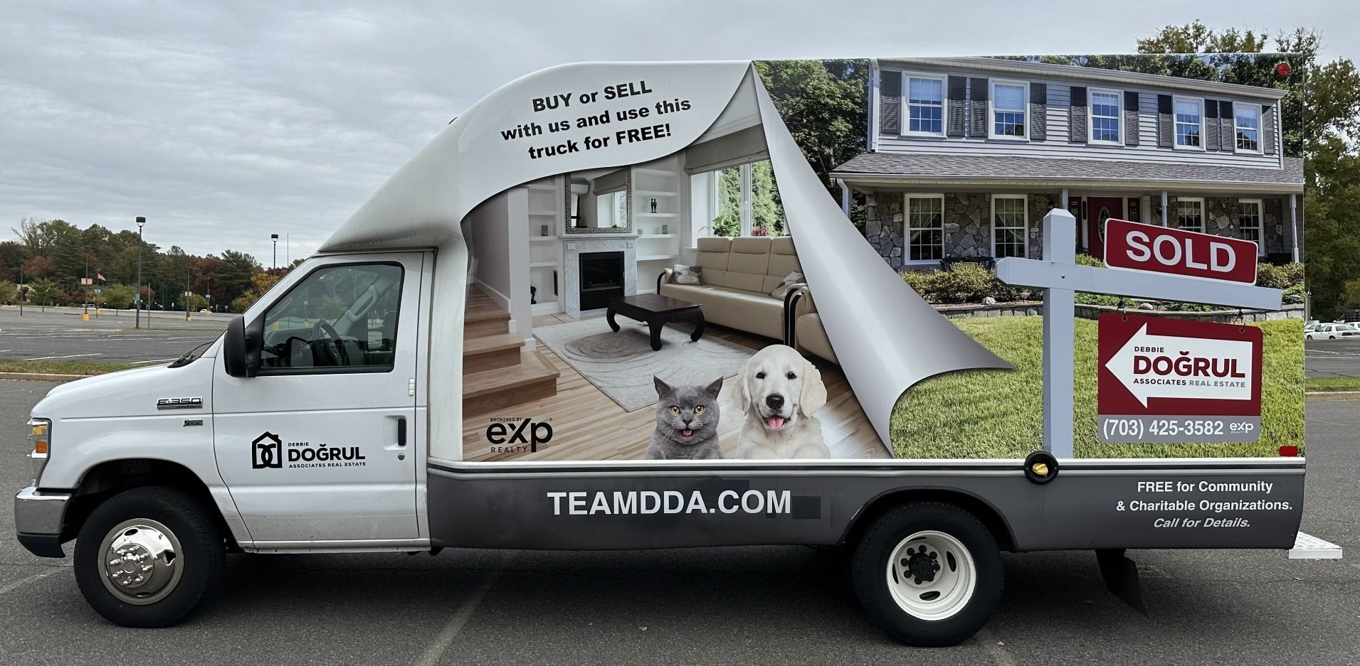 A white van with a sold sign on the back