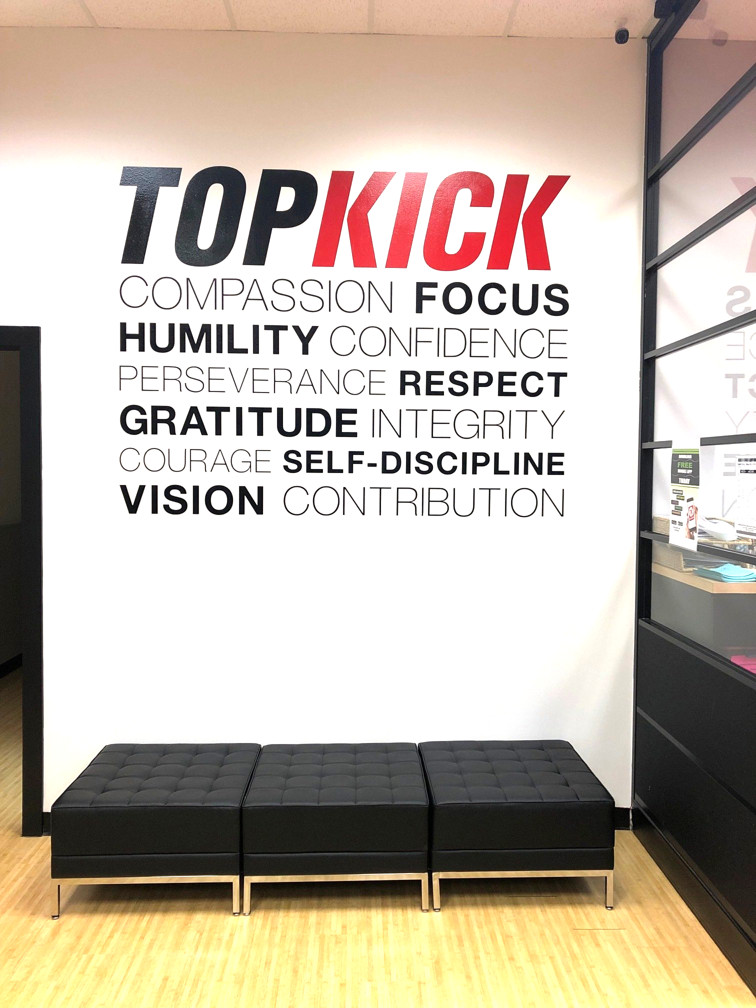 A wall with the words `` topkick '' written on it.
