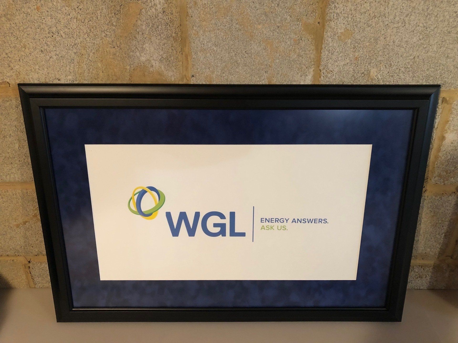 A framed picture with the wgl logo on it