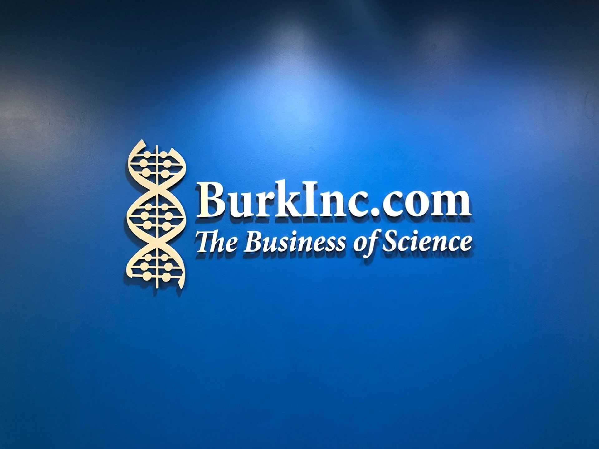 A blue sign that says burkinc.com the business of science