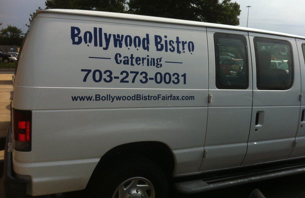 A white van with bollywood bistro catering written on the side