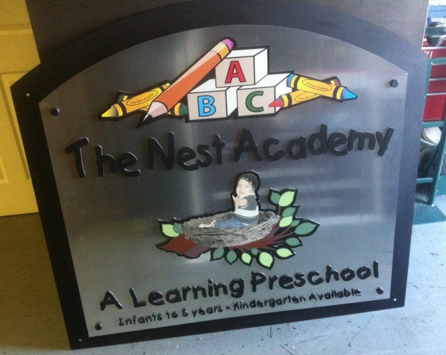 A sign for the nest academy a learning preschool