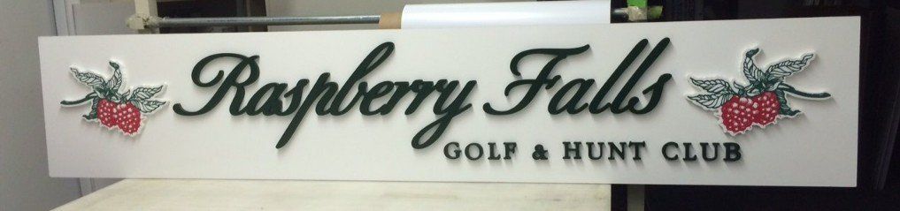 A sign for raspberry falls golf and hunt club