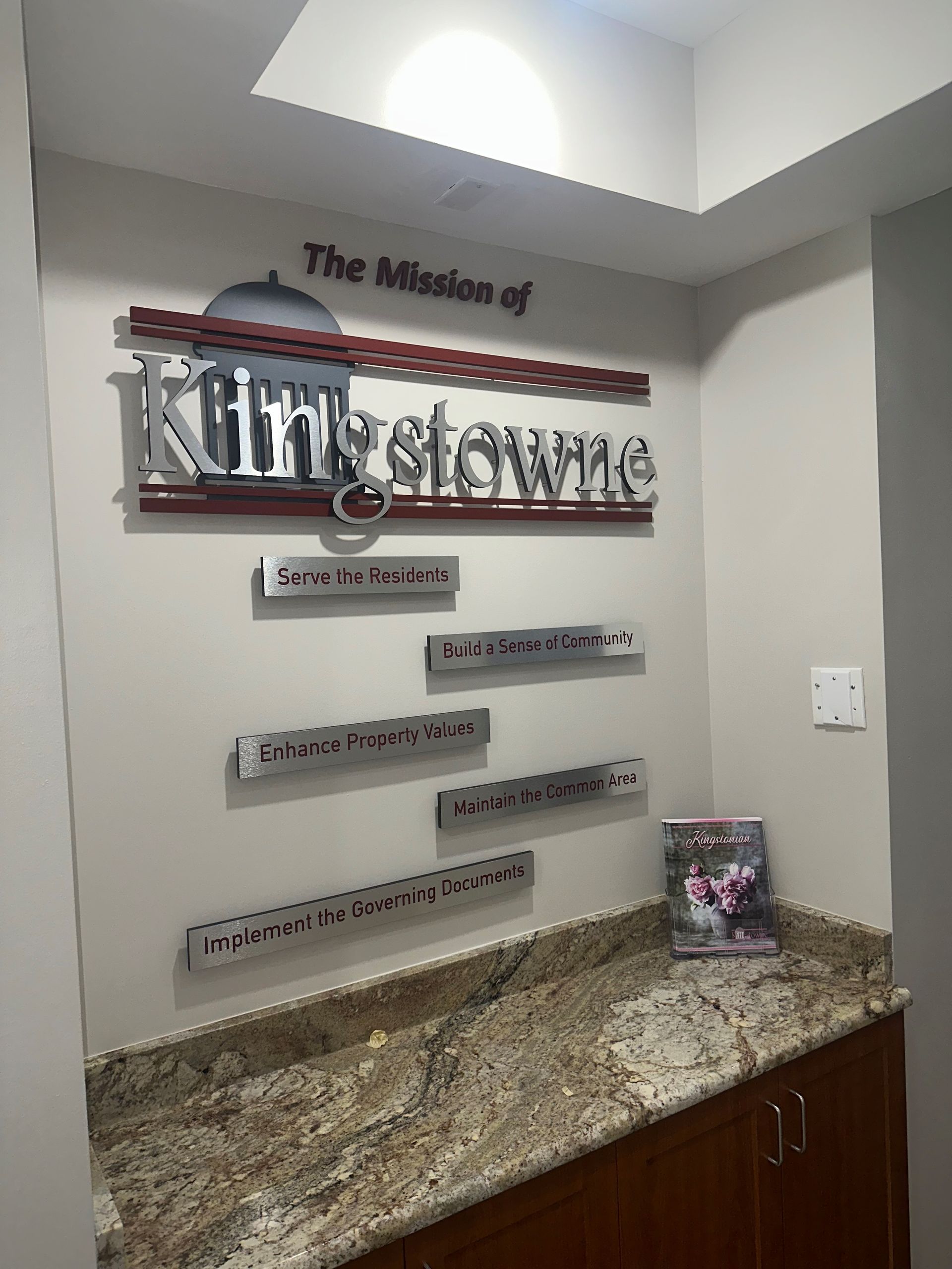 There is a sign on the wall that says the mission of kingswine.