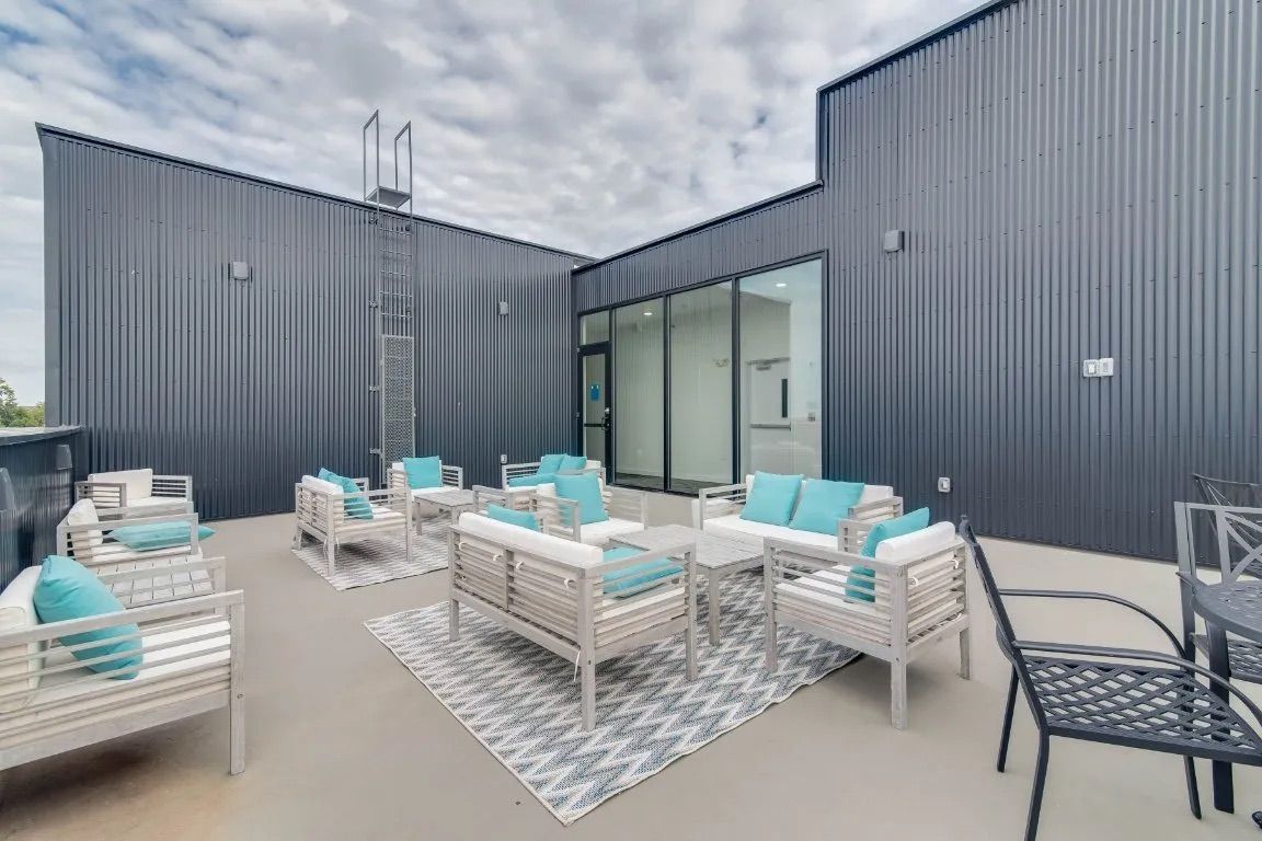 Clarksville, TN Pet-Friendly Student Apartments | Main608 | Fitness Center with Exercise Balls, Weight Training Machine, Stationary Bike, Elliptical Machines, Treadmills, and Expansive Windows.