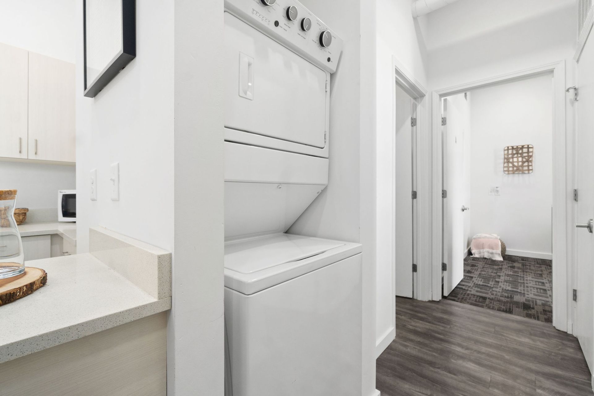 Photo showing a hallway with a washer and dryer