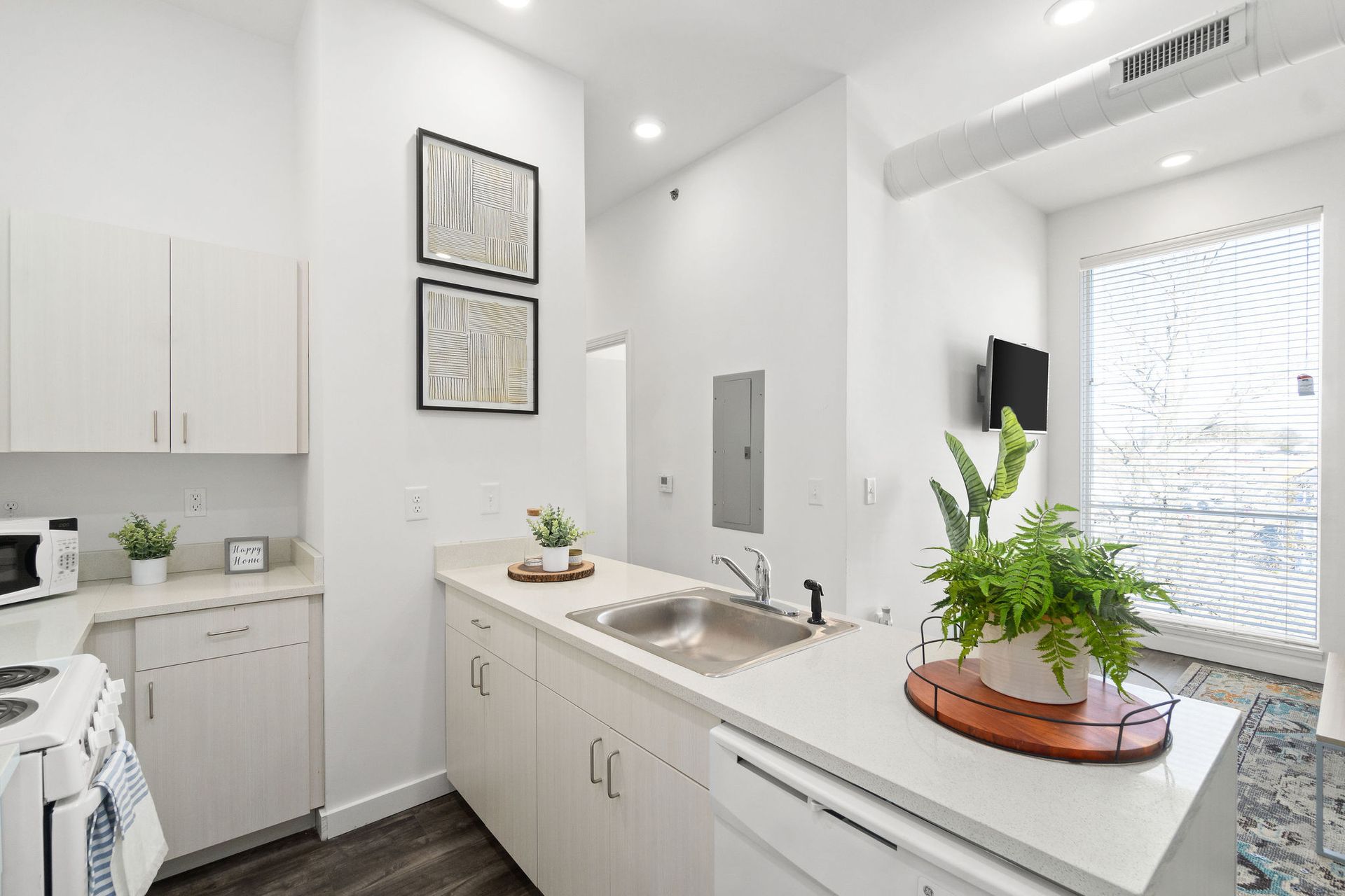 Photo showing a kitchen with a bar-like counter